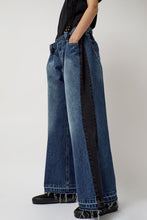 Load image into Gallery viewer, KSENIASCHNAIDER Baggy Jeans with Contrast Sidelines in Blue and Black