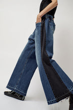 Load image into Gallery viewer, KSENIASCHNAIDER Baggy Jeans with Contrast Sidelines in Blue and Black